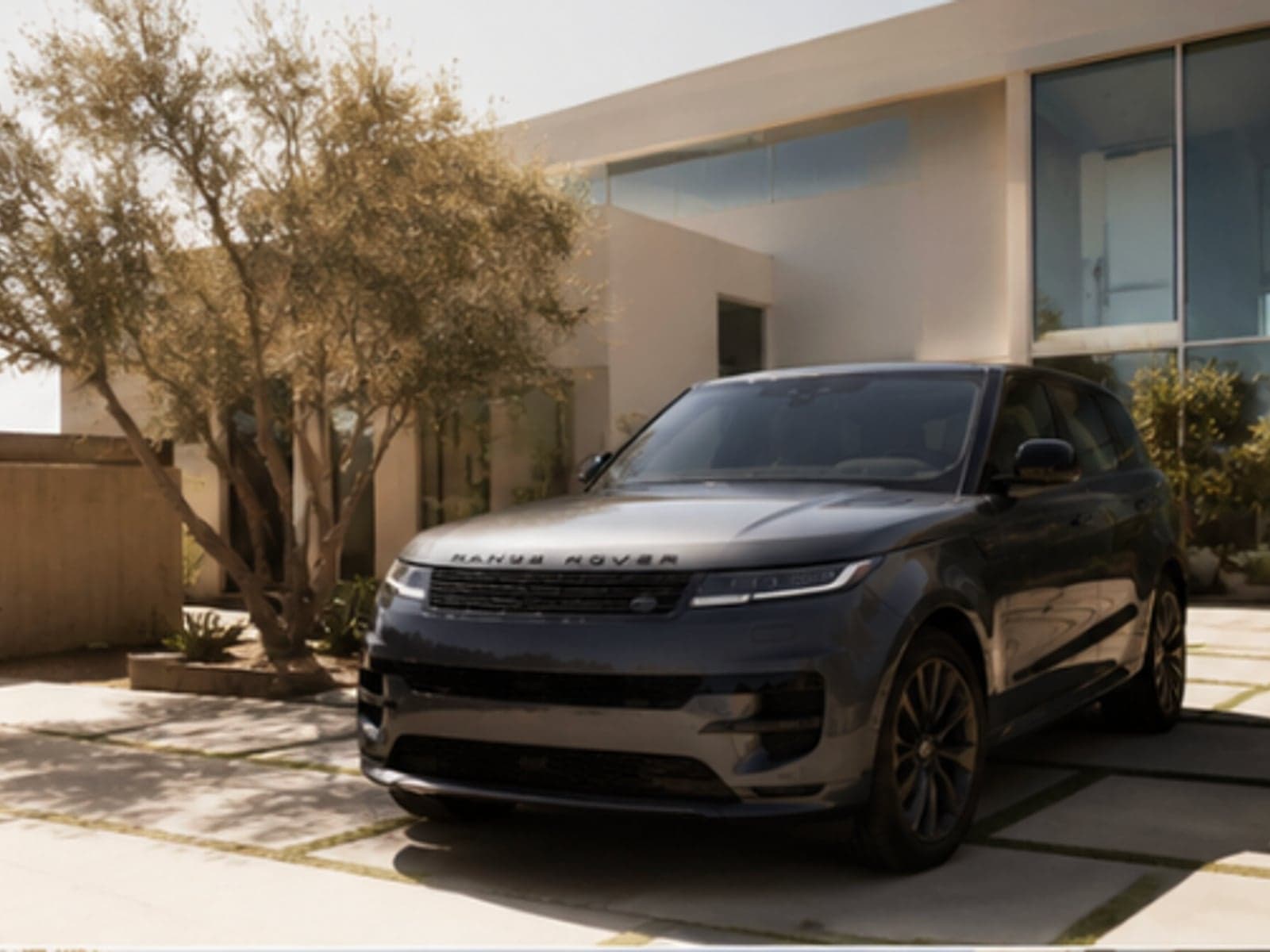 Range Rover parked in a sunny modern Redondo Beach driveway